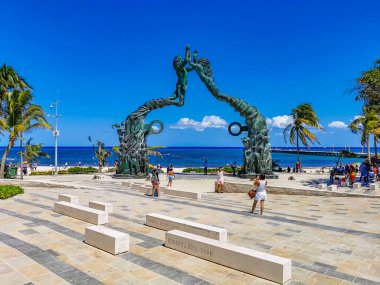 Playa del Carmen Mexico 14. May 2022 The ancient architecture of the Portal Maya in the Fundadores park with blue sky and turquoise seascape and beach panorama in Playa del Carmen Quintana Roo Mexico.