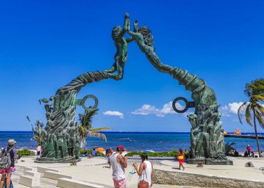 Playa del Carmen Mexico 14. May 2022 The ancient architecture of the Portal Maya in the Fundadores park with blue sky and turquoise seascape and beach panorama in Playa del Carmen Quintana Roo Mexico.