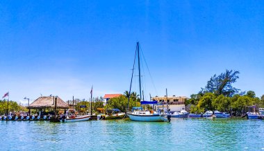 Holbox Mexico 16. May 2022 Panorama landscape view on beautiful Holbox island with boats Holbox ferry jetty village port harbor Muelle de Holbox and turquoise water in Quintana Roo Mexico.