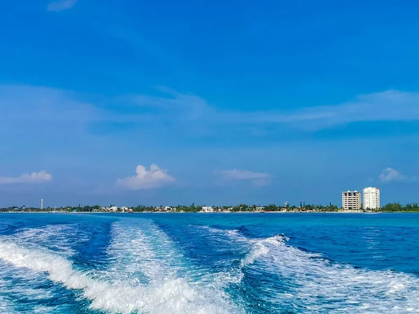 Boat trip from Cancun to Island Mujeres Isla Contoy and Whale shark tour with natural tropical beach seascape panorama blue turquoise green clear water and view from boat in Quintana Roo Mexico.