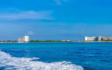 Boat trip tour from Cancun to Island Mujeres Isla Contoy and Whale shark tour with natural tropical seascape panorama and blue turquoise and green clear water view from boat in Quintana Roo Mexico.