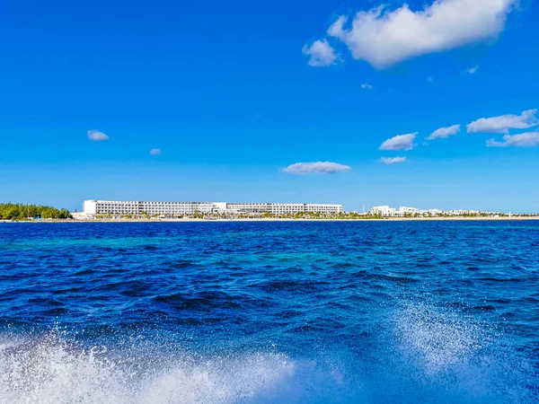 Boat trip tour from Cancun to Island Mujeres Isla Contoy and Whale shark tour with natural tropical seascape panorama and blue turquoise and green clear water view from boat in Quintana Roo Mexico.
