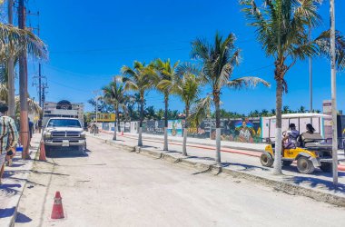 Holbox Mexico 16. May 2022 Colorful village on beautiful Holbox island with restaurant store vehicles people and mud in Quintana Roo Mexico.