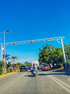 Cancun Mexico 13. January 2022 Typical street road and cityscape with cars and buildings of Cancun in Quintana Roo Mexico.
