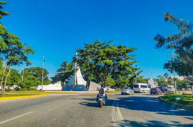 Cancun Mexico 13. January 2022 Typical street road and cityscape with cars and buildings of Cancun in Quintana Roo Mexico.
