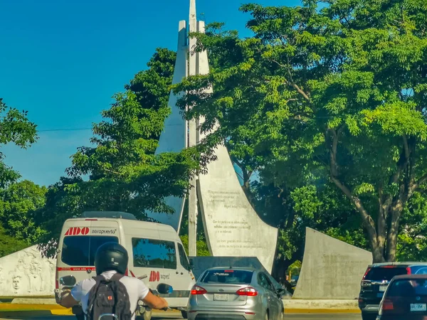 Cancun Mexico 13. January 2022 Typical street road and cityscape with cars and buildings of Cancun in Quintana Roo Mexico.