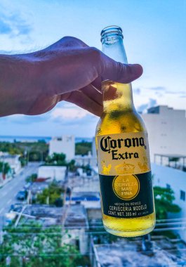 Playa del Carmen Mexico 28. April 2022 Pacifico beer bottle with amazing cityscape landscape and caribbean ocean and beach panorama view of Playa del Carmen in Quintana Roo Mexico.