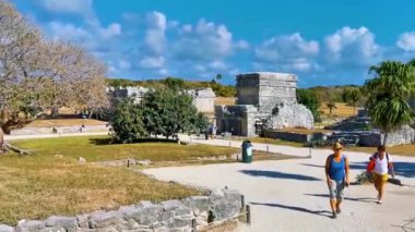 Tulum Mexico 03. April 2022 Ancient Tulum ruins Mayan site with temple ruins pyramids and artifacts in the tropical natural jungle forest palm and seascape panorama view in Tulum Mexico.