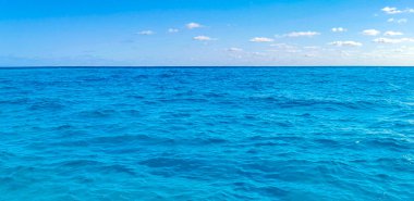 Beautiful blue and turquoise water waves ocean and sea texture pattern of Cancun in Quintana Roo Mexico.
