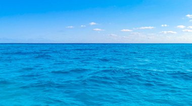 Beautiful blue and turquoise water waves ocean and sea texture pattern of Cancun in Quintana Roo Mexico.