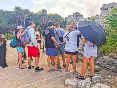 Tulum Mexico 29. July 2022 Ancient Tulum ruins Mayan site with temple ruins pyramids and artifacts in the tropical natural jungle forest palm and seascape panorama view in Tulum Mexico.