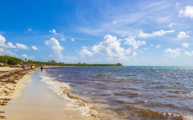 Playa del Carmen 18. August 2021 Tropical mexican beach landscape panorama full of people at beach parties on vacation in Playa del Carmen Mexico.