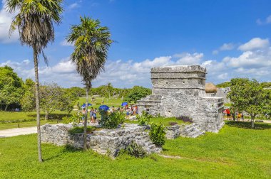 Tulum Mexico 01. August 2022 Ancient Tulum ruins Mayan site with temple ruins pyramids and artifacts in the tropical natural jungle forest palm and seascape panorama view in Tulum Mexico.