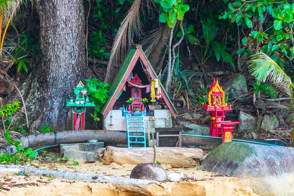Colorful decorated holy ghost house and holy shrine or small temple in the garden yard street road village in Sakhu Thalang on Phuket island Thailand in Southeastasia Asia.