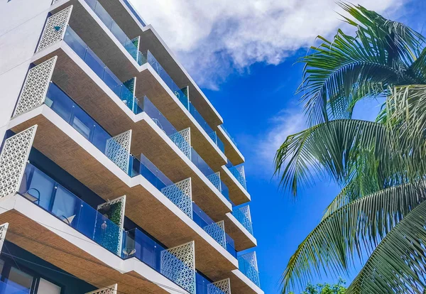 Typical street road and cityscape with resorts hotels houses buildings and apartments of Luis Donaldo Colosio Playa del Carmen in Mexico.