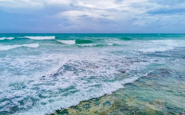 Hurricane 2021 thunderstorm tropical storm with the view on high strong waves wind and dark clouds from the pier Muelle Constituyentes in Playa del Carmen Quintana Roo Mexico.