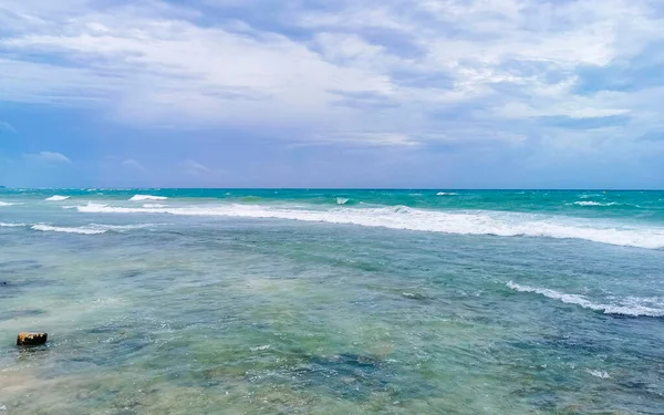 Hurricane 2021 thunderstorm tropical storm with the view on high strong waves wind and dark clouds from the pier Muelle Constituyentes in Playa del Carmen Quintana Roo Mexico.