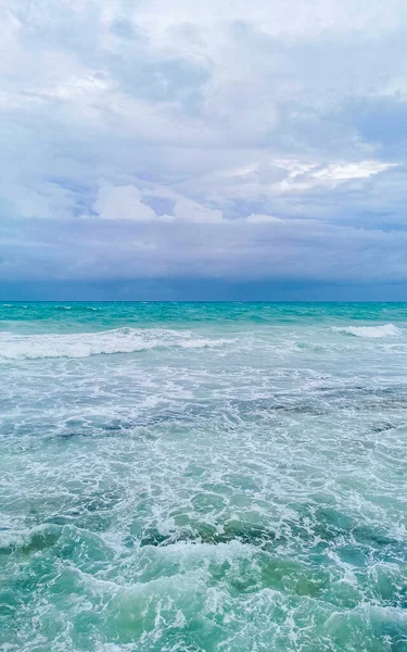 Hurricane 2021 thunderstorm tropical storm with the view on high strong waves wind and dark clouds from the pier Muelle Constituyentes in Playa del Carmen Quintana Roo Mexico.