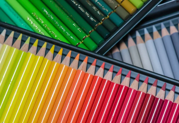 Numerous colored crayons assorted in a box — Stock Photo, Image