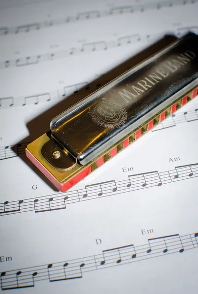 Note sheet and harmonica — Stock Photo, Image