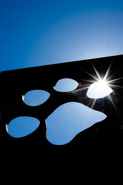 Silhouette of a cat paw with bright sunlight — Stock Photo, Image