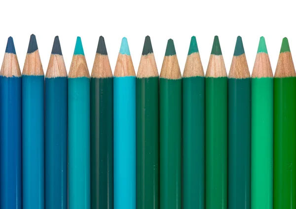 Fila com lápis de cor azul e verde — Fotografia de Stock