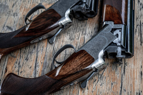 Detail Of Open Hunting Rifles Laying On Table