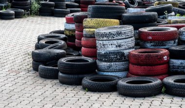 Pile Of Old Used Car And Bike Tyres Representing Hazardous Waste And Material For Recycling Rubber 