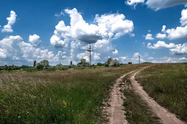Abandoned Gravel Road Rural Landscape Electricity Pylons Wires Hungary — Foto de Stock