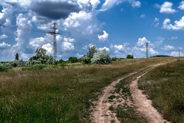 Abandoned Gravel Road Rural Landscape Electricity Pylons Wires Hungary — Stok fotoğraf