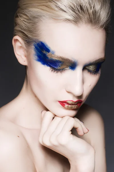 A blond woman with creative make up — Stock Photo, Image