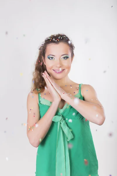 Brunette Woman blow away the confetti on her Birthday Party — Stock Photo, Image