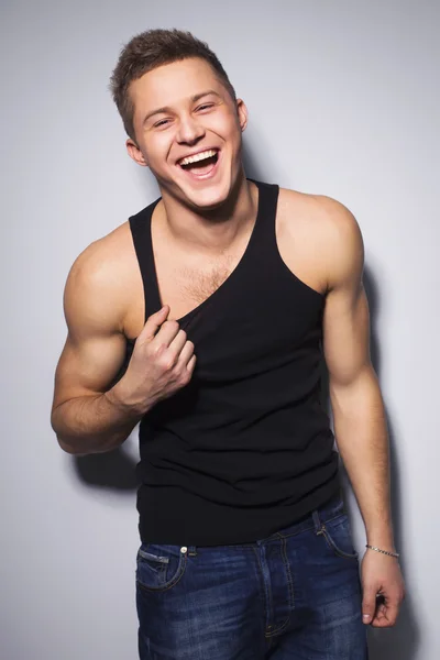 Handsome gorgeous young man in shirt indoor smiling — Stock Photo, Image