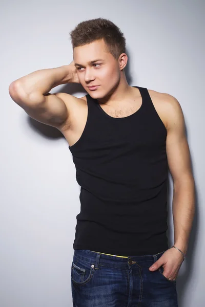 Handsome gorgeous young man in shirt indoor smiling — Stock Photo, Image