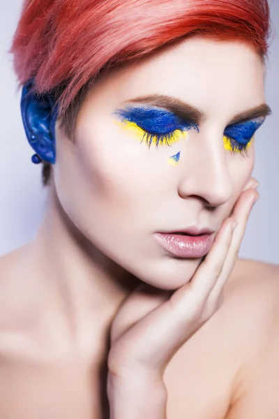 Young person closing ears and don't want to listen political lies crying. Ukrainian symbols and colors — Stock Photo, Image