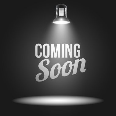 Coming soon message illuminated with light projector clipart