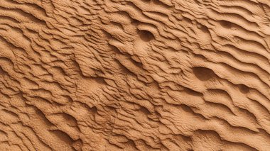 Çöldeki kumun dokusu. Dalgalı kum arka planı. Üst görünüm.