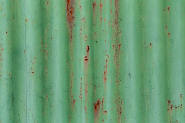 Oluklu metal dokusu veya pas, yeşil renk, soyut arkaplan kalıntılarıyla demir çelik dokusu.