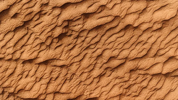 Texture of the sand in the desert. Wavy sand background. Top view.