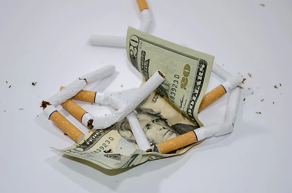 Cigarettes with dollar — Stock Photo, Image