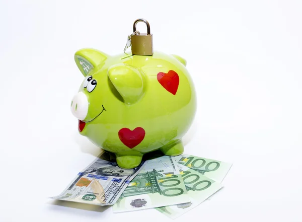 Piggybank с Dollar.Euro и навесной замок — стоковое фото