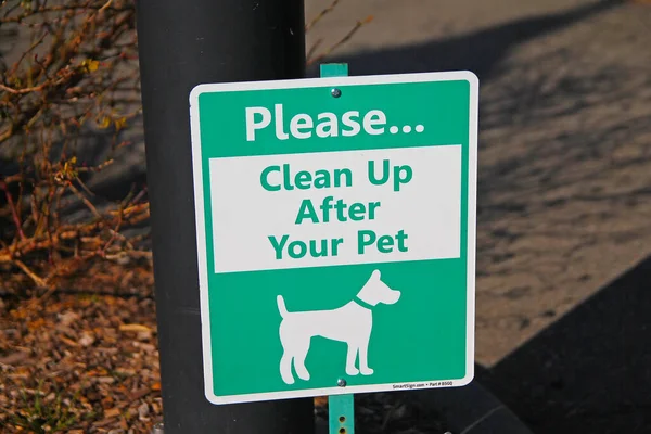 Please Clean Your Pet White Green Sign Sunny Day — Stock Photo, Image