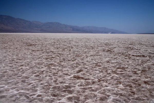 The salty snow covering the Devils Golf Course rock formation in the Death Valley desert in California