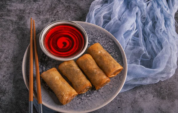 Vietnamese spring rolls with sweet sauce.