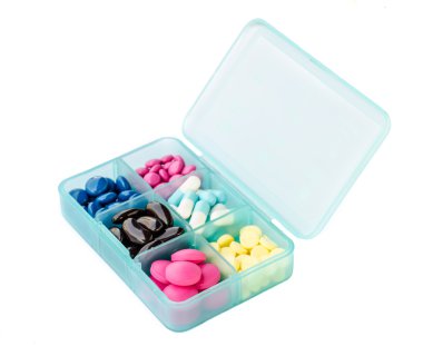 Tablet dispenser with pills clipart