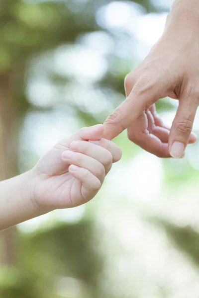 Hands of mother and son — Stock Photo, Image