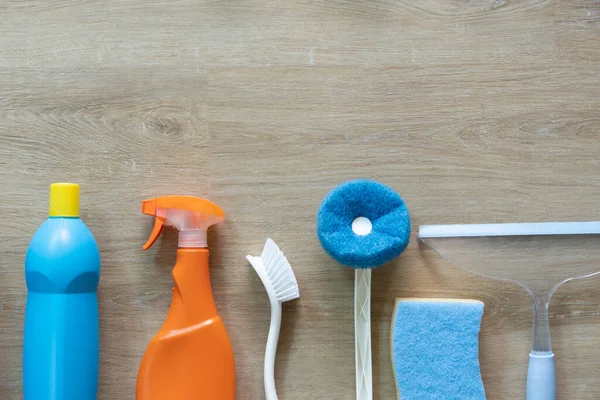 House cleaning plastic product on wood table background, home service or housekeeping concept