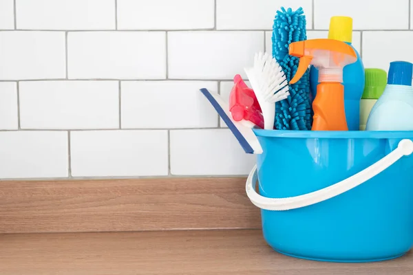 House cleaning plastic product on wood table with copy space background, home service or housekeeping concept