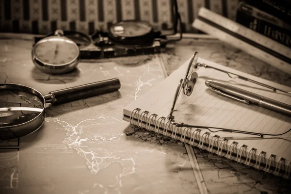 Vintage still life with old spectacles on book near desk lamp