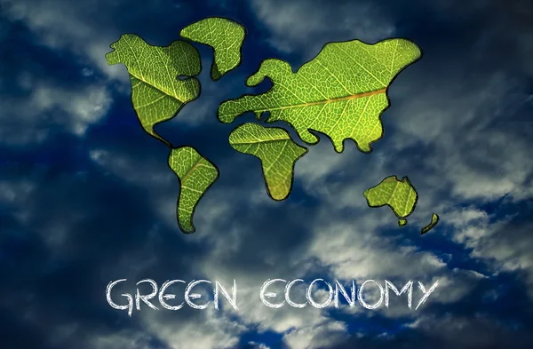 green economy, world map covered by green leaves